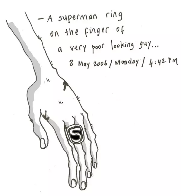 -A superman ring on the finger of a very poor looking guy...