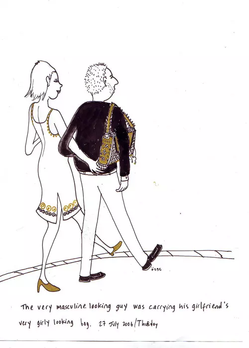 The very masculine looking guy was carrying his girlfriend's very girly looking bag.