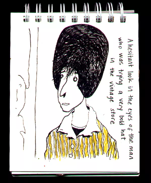 A hesitant look in the eyes of the man who was trying a very bold hat in the vintage store