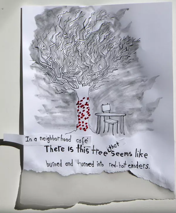 In the neighborhood café There is this tree that seems like burned and turned into red-hot cinders