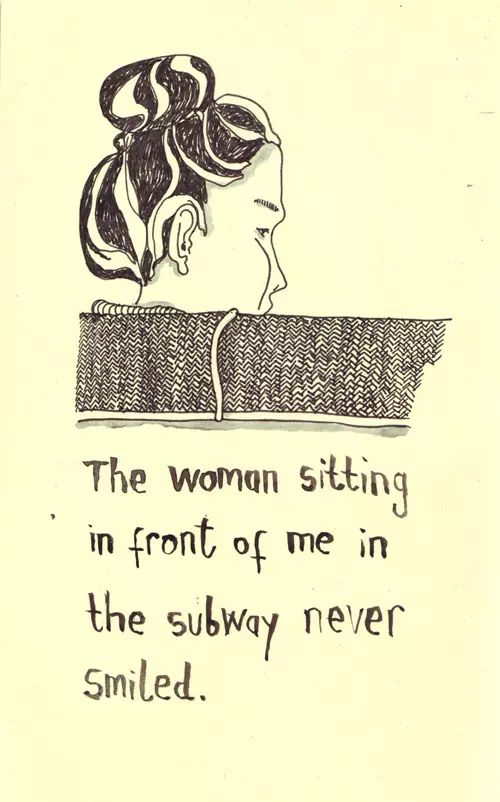 The woman sitting in front of me in the subway never smiled.
