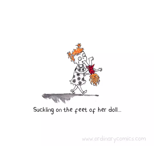 Sucking on the foot of her doll….